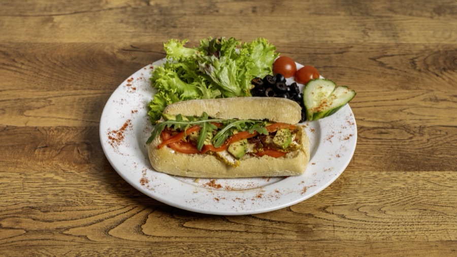 Grilled vegetable sub with mozzarella and a side salad.